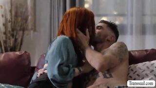 Redhead shemale and her new handsome boyfriend are on the couch kissing each other.After that,she throats his dick and lets him bang her wet ass.