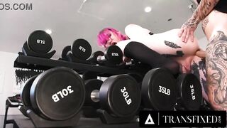 Pink haired hottie Lena Moon drops her phone in the gym and gets STUCK trying to pick it up. Gym buddy Hatler Gurius, notices her ass peeking out and takes advantage of the situation! He bareback's her ass and gets deepthroated while she's stuck