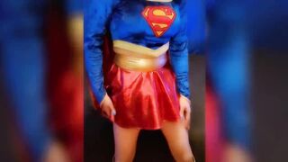 SuperGirl in Shiny Spandex Teases and Plays with Herself